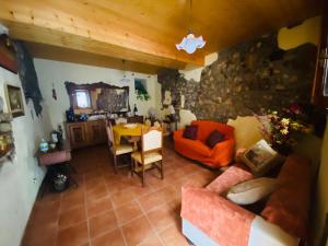 a living room with a couch and a table at Casa vacanze Da Mammanonna in Taurasi +13 photos