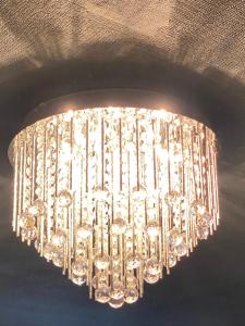 a chandelier is hanging from the ceiling at Ideal Abode Leonard chester in Chester