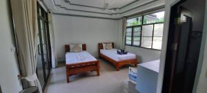 Postel nebo postele na pokoji v ubytování TropiCoco Beach Resort Koh Phangan