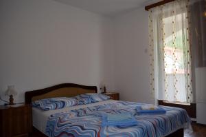 Postel nebo postele na pokoji v ubytování Apartments Drita