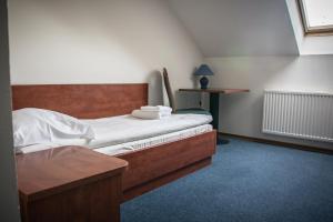 Un pat sau paturi într-o cameră la Hotel Ach To Tu