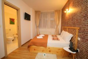 Katil atau katil-katil dalam bilik di Rustic Studio
