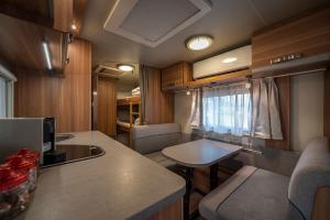 a kitchen and living room of an rv at Park Timna in Eilat