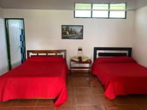 Postel nebo postele na pokoji v ubytování Hospedaje Rancho Guadalupe