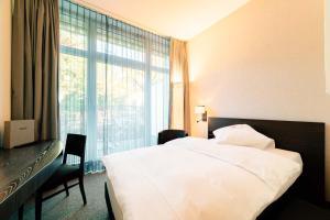 Katil atau katil-katil dalam bilik di Park Hotel Winterthur