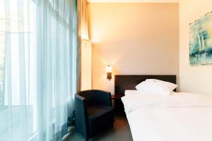 Katil atau katil-katil dalam bilik di Park Hotel Winterthur