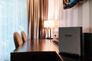 Televisyen dan/atau pusat hiburan di Park Hotel Winterthur