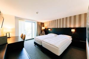Katil atau katil-katil dalam bilik di Park Hotel Winterthur