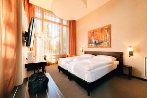 Katil atau katil-katil dalam bilik di Park Hotel Winterthur