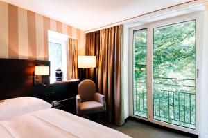Katil atau katil-katil dalam bilik di Park Hotel Winterthur
