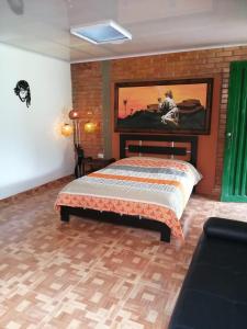 Postel nebo postele na pokoji v ubytování Hospedaje Rancho Guadalupe