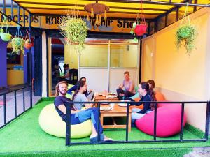 a group of people sitting on bean chairs in a restaurant at Hotel Rhinoceros-Homestay in Sauraha
