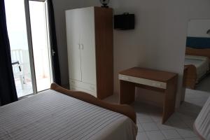 Postel nebo postele na pokoji v ubytování Hotel Ristorante Mareblu