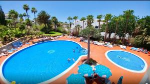 an overhead view of a swimming pool in a resort at Аpartment 1 bedroom center of Las Americas El Dorado in Playa de las Americas