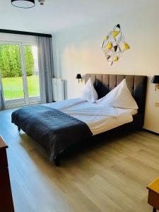 Posteľ alebo postele v izbe v ubytovaní HappyLivingApartments