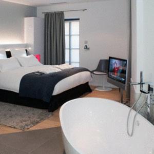 Letto o letti in una camera di Hôtel Quatorze