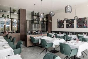 
A restaurant or other place to eat at NIDUM - Casual Luxury Hotel

