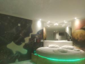เตียงในห้องที่ Hotel 1001 Prime - Ceilândia
