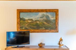 TV a/nebo společenská místnost v ubytování Charming Civetta