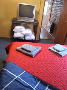 En eller flere senge i et værelse på El Gringo Tito