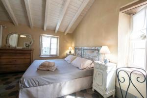 Postel nebo postele na pokoji v ubytování Borgo dei Gatti Albergo Diffuso & spa + 37 fotografií