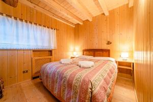 Voodi või voodid majutusasutuse Chalet Sottoguda toas