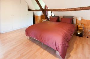Tempat tidur dalam kamar di Lien's Cottage