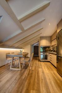 a kitchen with a table and chairs in a room at Giataki in Elati Trikalon