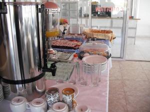 a table with glasses and other items in a store at Antonis Hotel in Kefalos