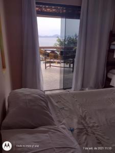 Postel nebo postele na pokoji v ubytování Pousada Mar de Araçatiba