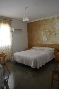 Cama o camas de una habitación en Hostal Manolete