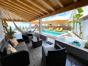 a living room with a swimming pool and a patio at Casa Holi in Valada
