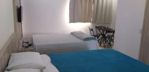 Säng eller sängar i ett rum på Flat 259 localizado no Condomínio Solar Água