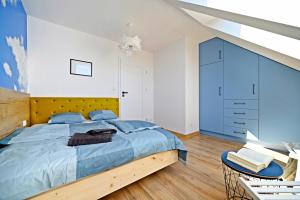 Krevet ili kreveti u jedinici u okviru objekta Szczyrk Apartament Niebo - sauna 6 osób