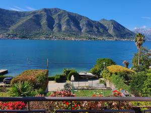 a view of a lake with mountains in the background at La Grande Apartments in Kotor