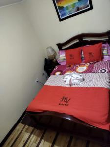 Postel nebo postele na pokoji v ubytování HOTEL VELANEZ SUITE Riobamba