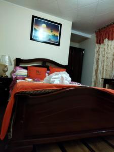 Postel nebo postele na pokoji v ubytování HOTEL VELANEZ SUITE Riobamba