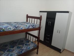 Ένα ή περισσότερα κρεβάτια σε δωμάτιο στο Bruno Conde Casa na praia