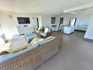 a living room with a couch and chairs at Surfers Chalet in Gold Coast
