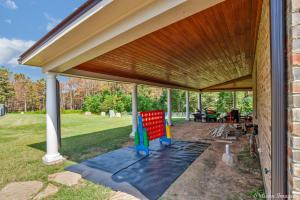 awning over a patio of a house at Lakefront Fully Loaded Apartment in Shreveport