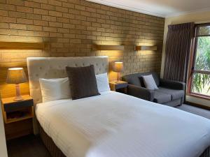 מיטה או מיטות בחדר ב-AAt 28 Goldsmith Motel