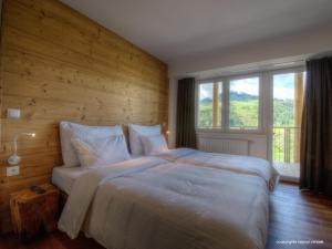 מיטה או מיטות בחדר ב-Residence Alpin Kaprun by Kaprun Rentals