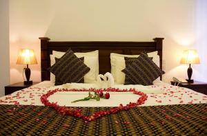 En eller flere senge i et værelse på Hotel Bamiyan