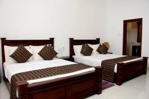 Posteľ alebo postele v izbe v ubytovaní Hotel Bamiyan