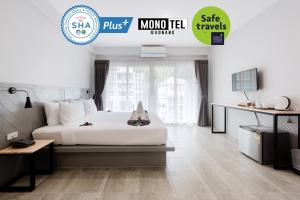 Postel nebo postele na pokoji v ubytování Monotel Aonang