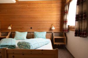 Postel nebo postele na pokoji v ubytování Alpina Hotel-Apartments