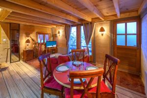 a dining room with a table and chairs at Petit Rochebrune in Orcières