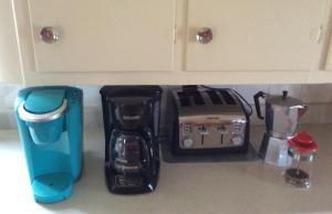 a kitchen counter with a coffee maker and a blender at La Bohème in Frampton