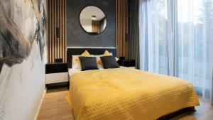 Postel nebo postele na pokoji v ubytování Kalinowa z sauną, Sun & Snow