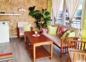 a living room with a couch and a table at Apartment Nicole in Plovdiv